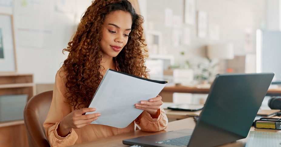 woman looking over the new tax bracket update