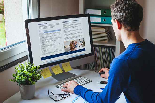 man typing at computer