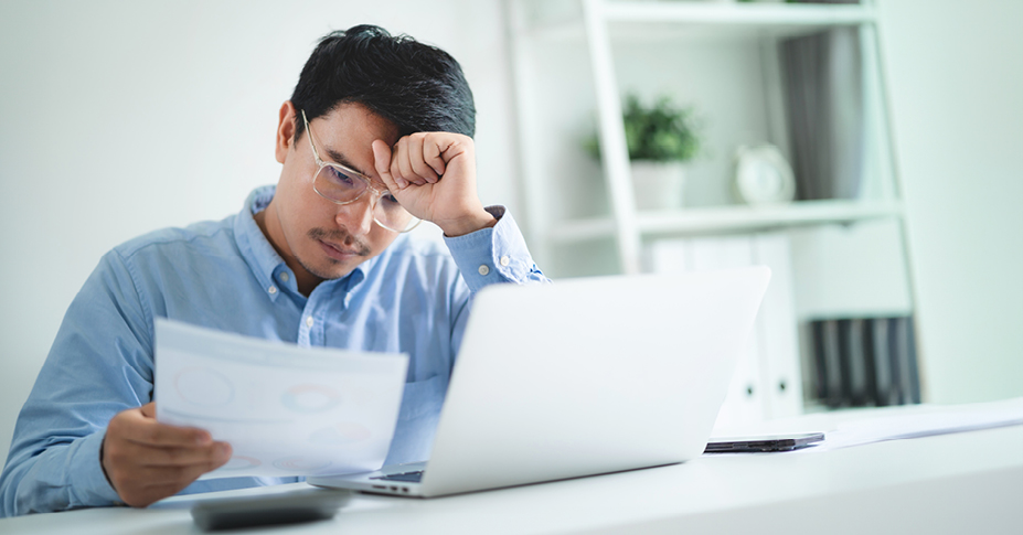 man struggling to not make checkbook ira mistakes